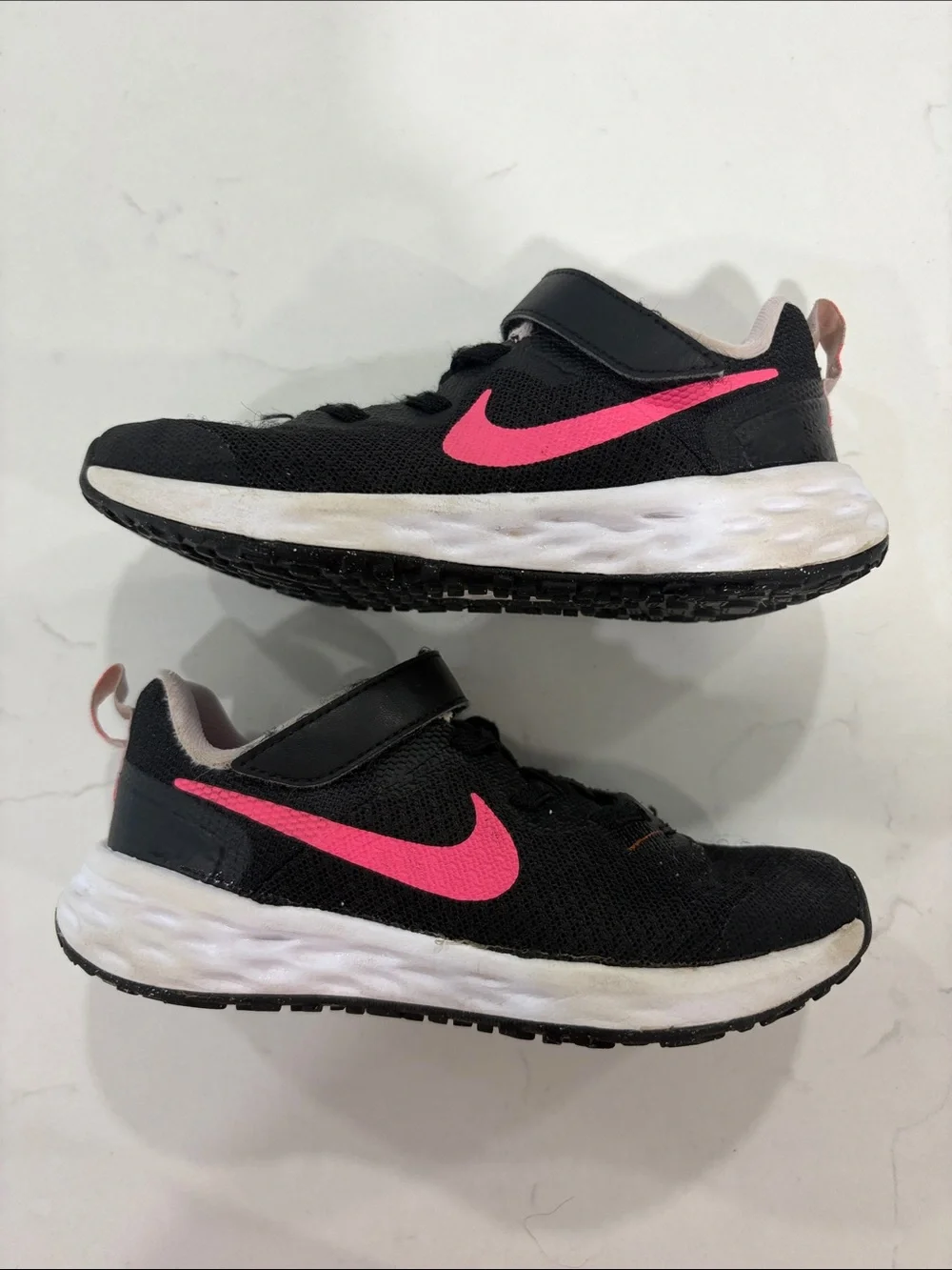 Nike Kids Black Sneakers with Pink Swoosh